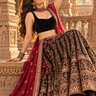Crimson lehenga in golden temple light 1